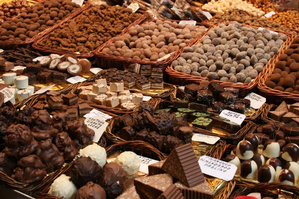 brown and white round fruits and chocolate on brown wooden crate
